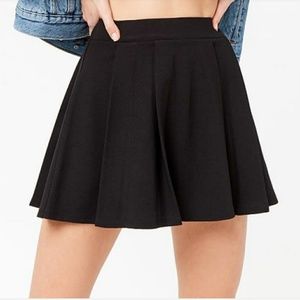 NWOT. Black pleated knit mini skirt